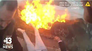 Body cam footage: Bystander, officer pull driver from burning car after crash on Las Vegas Strip