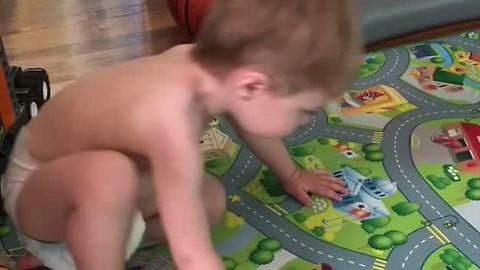 Toddler Tries To Keep Up With His Dad's Workout Routine