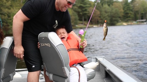 Toddler breaks into tears after reeling in fish