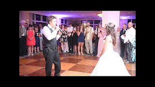 Groom surprises bride with singing performance at reception