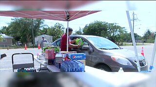 Community members host drive thru food drive for Dunbar Community.