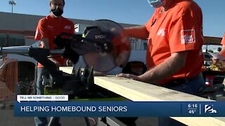 Home Depot volunteers help build wheelchair ramps