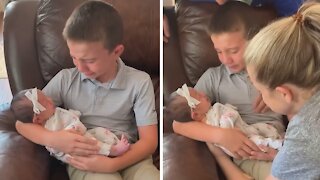 Emotional big brother meets newborn sister for the first time