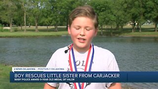Bicby boy rescues little sister from carjacker
