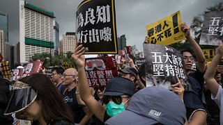 Hong Kong Protesters Hold Peaceful March After Chaotic Demonstrations