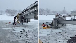 Firefighters rescue two people from submerged truck