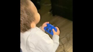 Happy kid thinks he's playing video games with his dad
