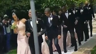 Wedding party pulls off synchronized dance down the aisle