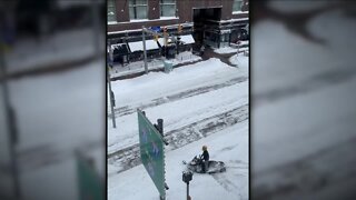 Snowmobile flying down Euclid Ave. symbolizes how ridiculous this snowstorm has been