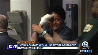 Woman charged with killing mom