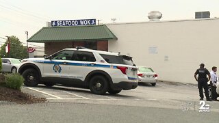 Employees: Cook shot delivery driver inside pizza shop in Owings Mills