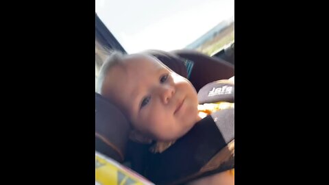 Baby girl is blowing kisses in the car!.mp4