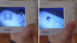 Baby pretends to sleep after getting caught standing up in crib