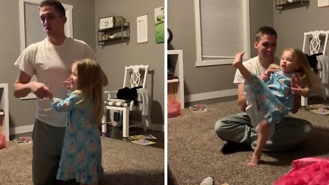 Dad drops daughter while distracted by the game