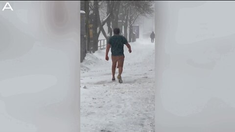 Lad Captured Braving The Snow In Nothing But Shorts And T-Shirt