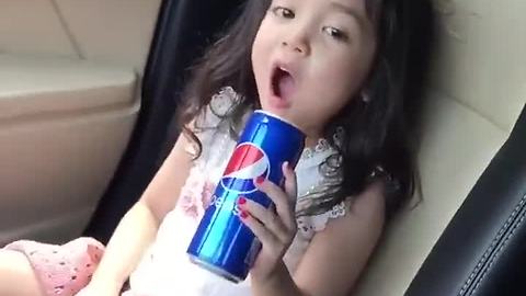 Little girl preciously sings along to her favorite artist