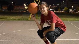 Youngster demonstrates basketball and soccer skills... at the same time!