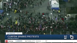 California curfew sparks protest in Huntington Beach