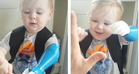 Cute little lad gives dad a high 5