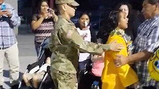 Soldier surprises sister at her graduation ceremony