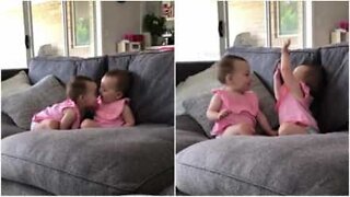 Baby twins' sweet moment caught on camera