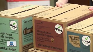 Girl Scouts deliver donated cookies
