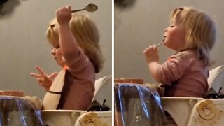 Adorable toddler loves getting messy during food time