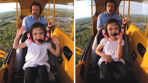 Little girl absolutely thrilled for airplane ride