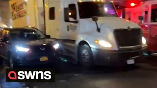 Truck gets stuck under a low hanging Subway station in NYC