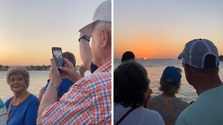 Elderly couple share special moment at sunset