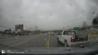 Clueless driver nearly crashes into oncoming car