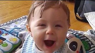 Baby's Priceless Reaction To Scalp Massager
