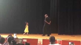 Father and daughter dance beautifully together at school performance