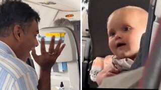 Stranger helps calm baby on flight with peek-a-boo