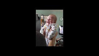 Cute baby laughing at dads funny face