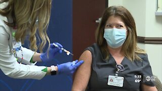 Healthcare workers who treated Florida's first COVID-19 patient receive vaccine