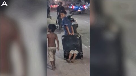 Amusing Clip Shows Girl Dragged Around In Suitcase