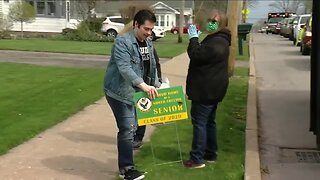 High school seniors celebrated with lawn signs