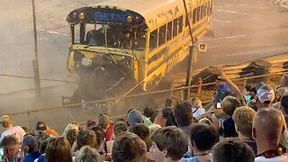 SCHOOL BUS RACE TAKES DANGEROUS TURN AS CRASH CAUSES VEHICLE TO PLOUGH THROUGH FENCE BETWEEN TRACK AND SPECTATORS