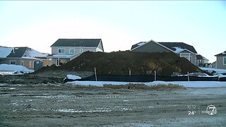 Arapahoe County family says a home builder is covering their property in dirt after a dispute