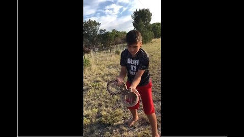 Real life Mowgli casually picks up rattlesnake