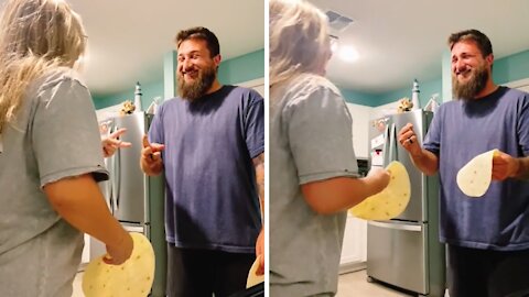 Couple play rock-paper-scissors with hilarious twist