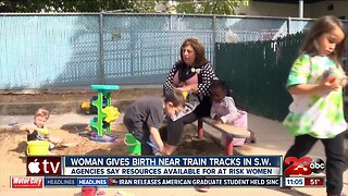 Woman gives birth near train tracks