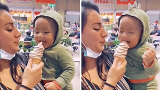 Baby thinks eating ice cream is absolutely hysterical