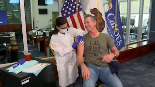 Governor Gavin Newsom gets flu shot during press briefing