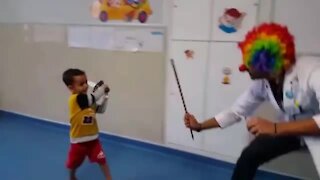 Doctor dresses up to play with his patient