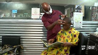 Local barbershop owner offers free haircuts and books to children