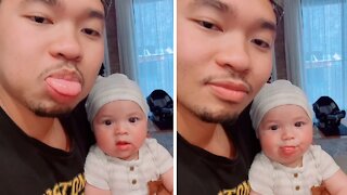 Adorable baby is definitely daddy's girl for life