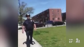 Baltimore police sergeant under investigation after video shows him coughing near residents