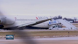 Delta plane slides off taxiway